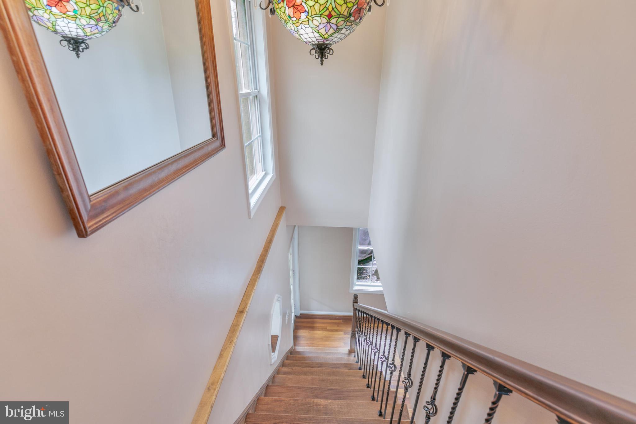 210 Northmoor Drive Silver Spring, MD 20901 - Photo 14 of 43 a view of a hallway with wooden floor and stairs