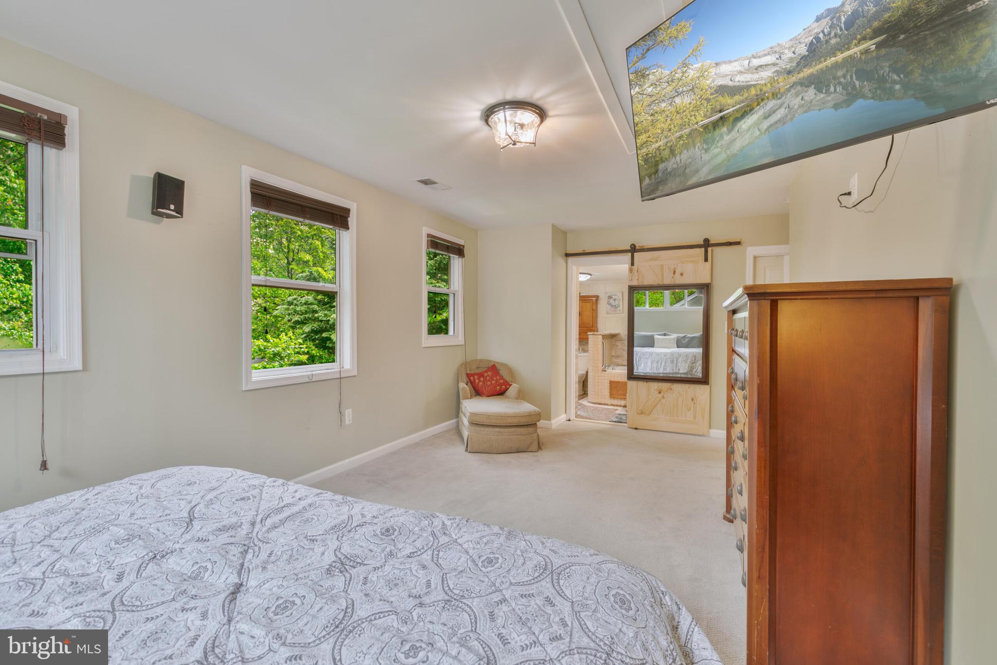 210 Northmoor Drive Silver Spring, MD 20901 - Photo 19 of 43 a bedroom with a bed and large windows