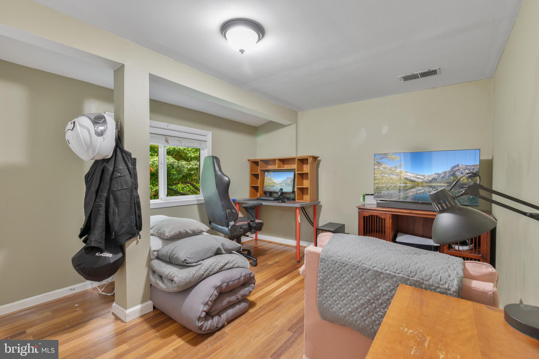 210 Northmoor Drive Silver Spring, MD 20901 - Photo 22 of 43 a living room with furniture and a flat screen tv