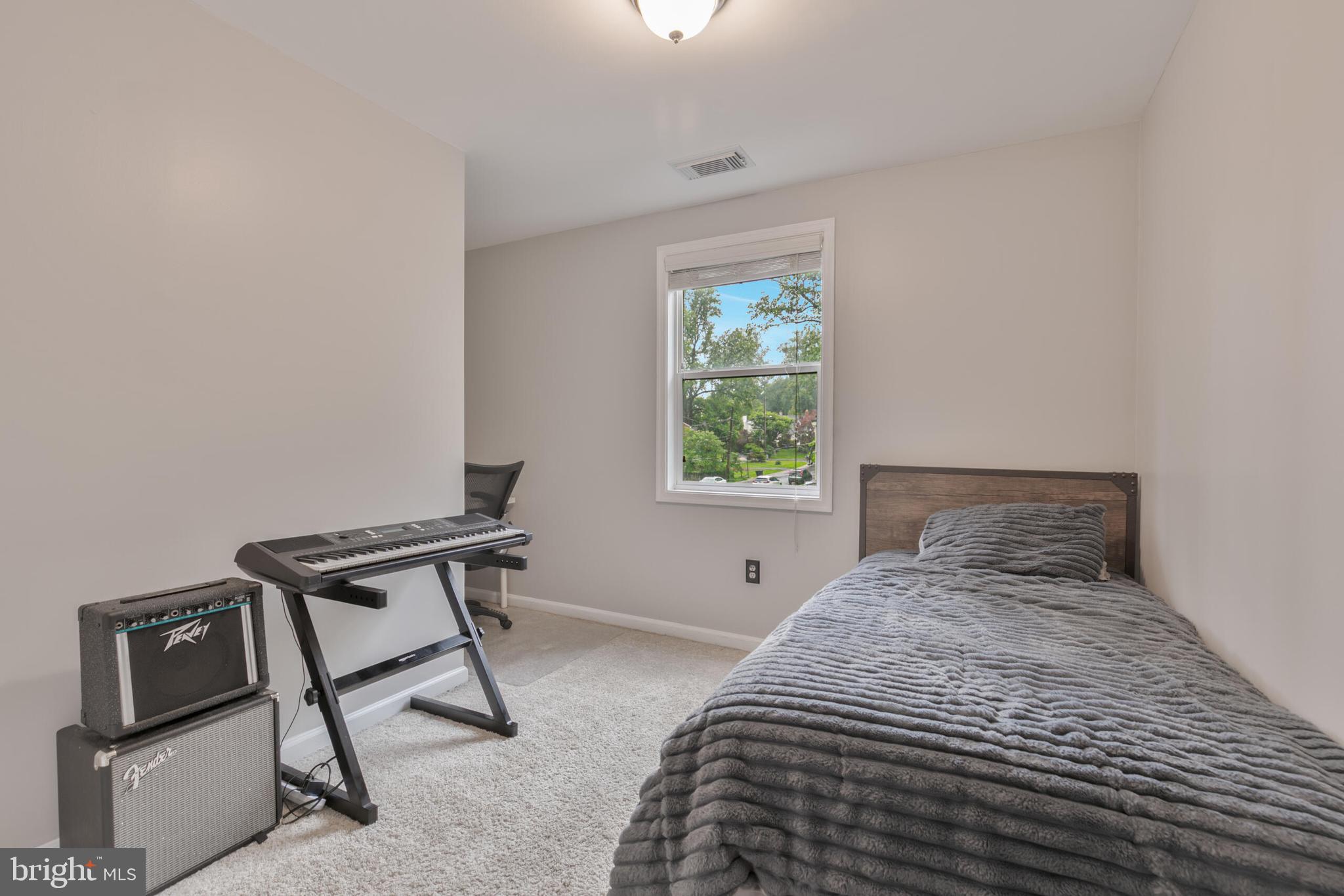 210 Northmoor Drive Silver Spring, MD 20901 - Photo 24 of 43 a bedroom with a bed and a window