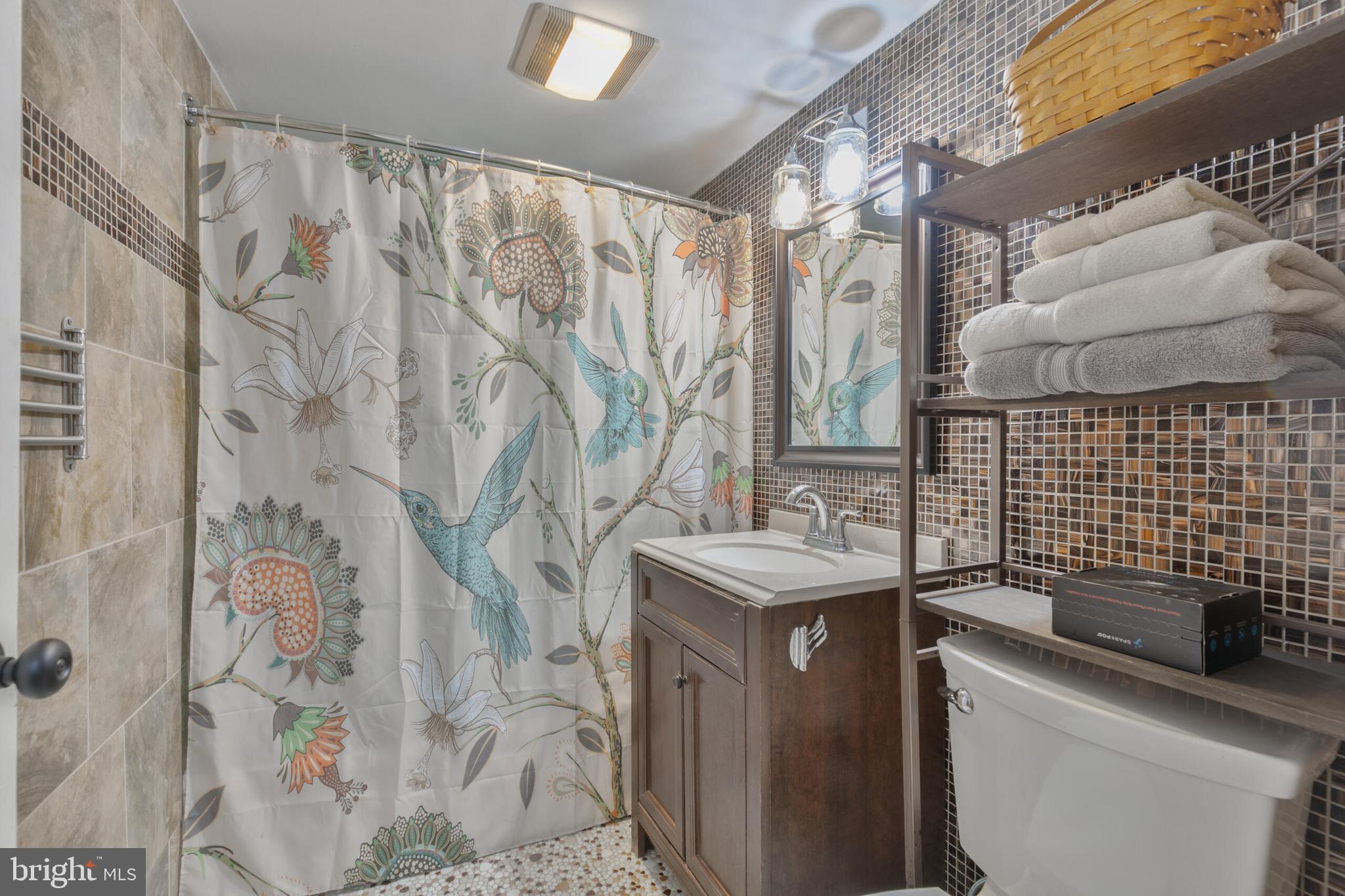 210 Northmoor Drive Silver Spring, MD 20901 - Photo 25 of 43 a bathroom with a sink toilet and shower