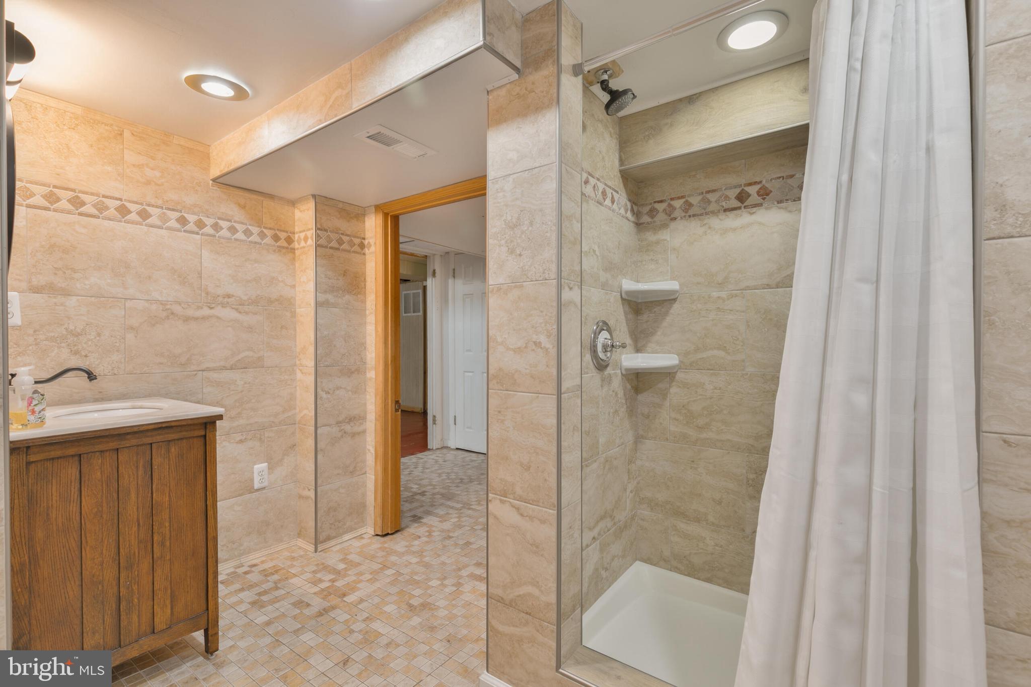 210 Northmoor Drive Silver Spring, MD 20901 - Photo 31 of 43 a bathroom with a shower and a sink