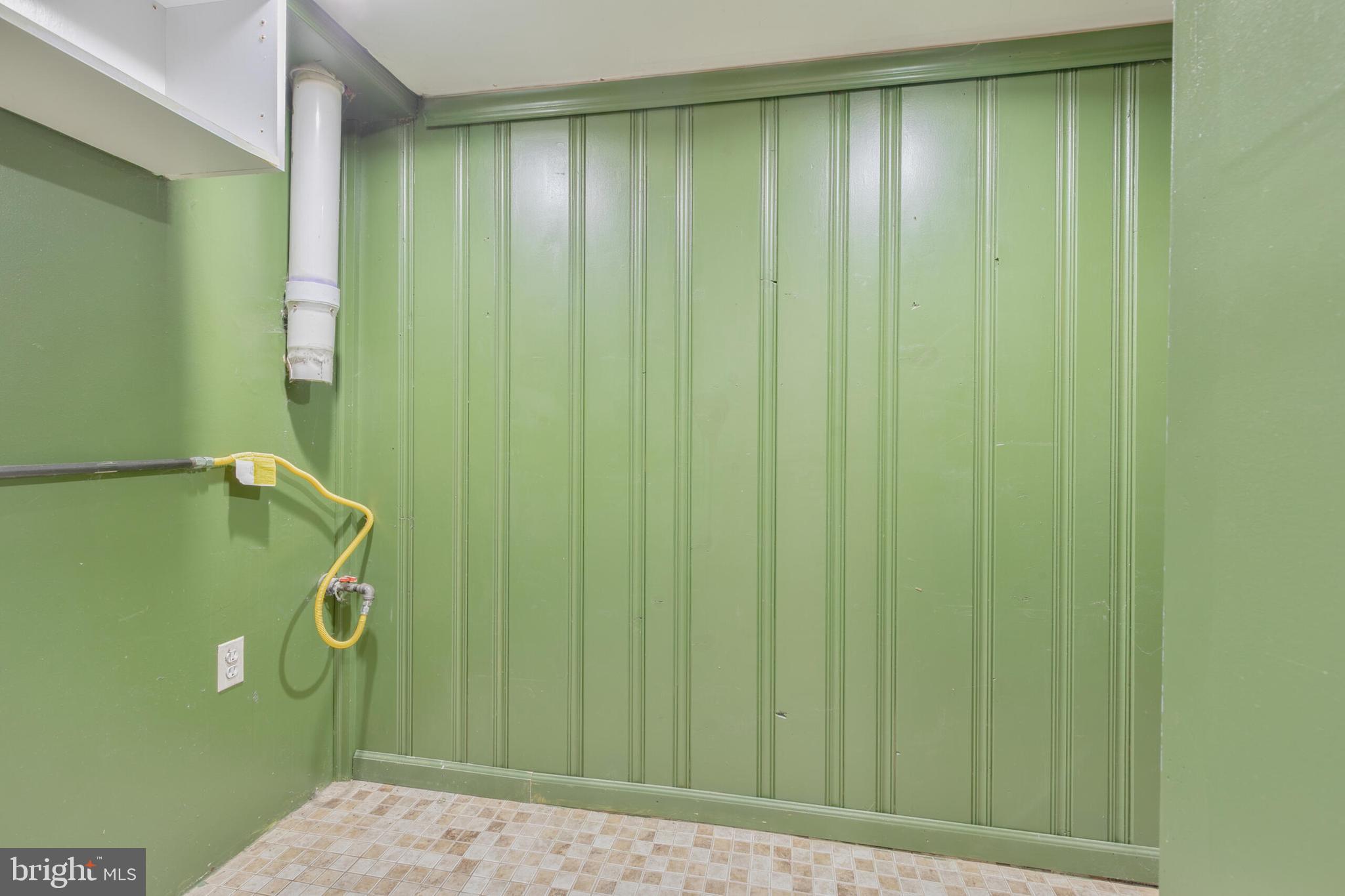 210 Northmoor Drive Silver Spring, MD 20901 - Photo 36 of 43 a bathroom with a shower curtain and a window