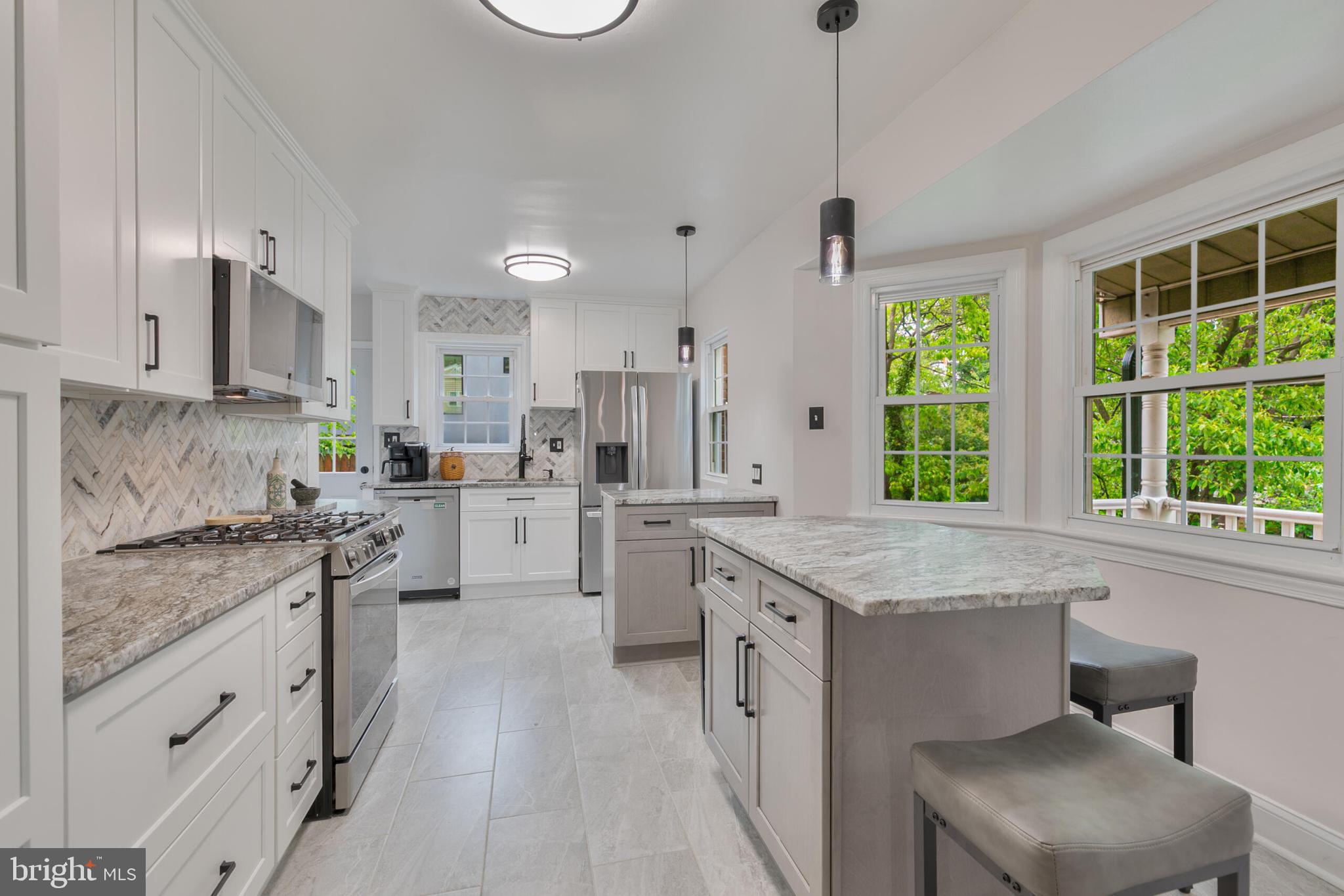 210 Northmoor Drive Silver Spring, MD 20901 - Photo 7 of 43 a kitchen with white cabinets and window