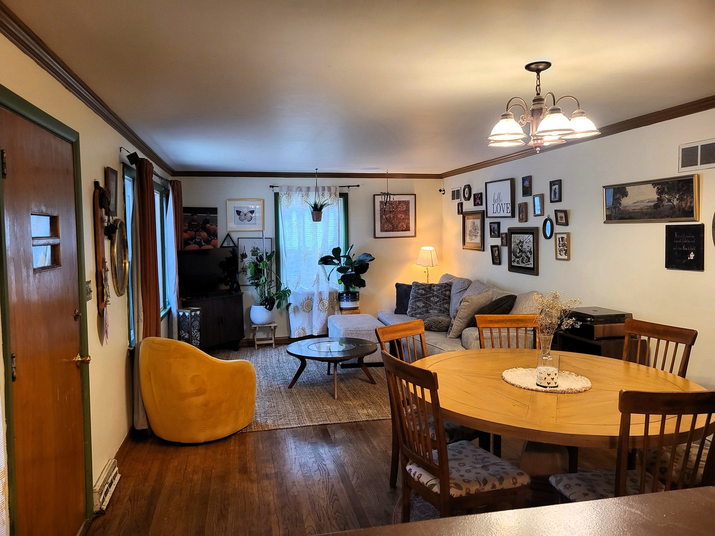 914 Cooper Street Dixon, IL 61021 - Photo 2 of 10 a view of a dining room with furniture a chandelier and wooden floor