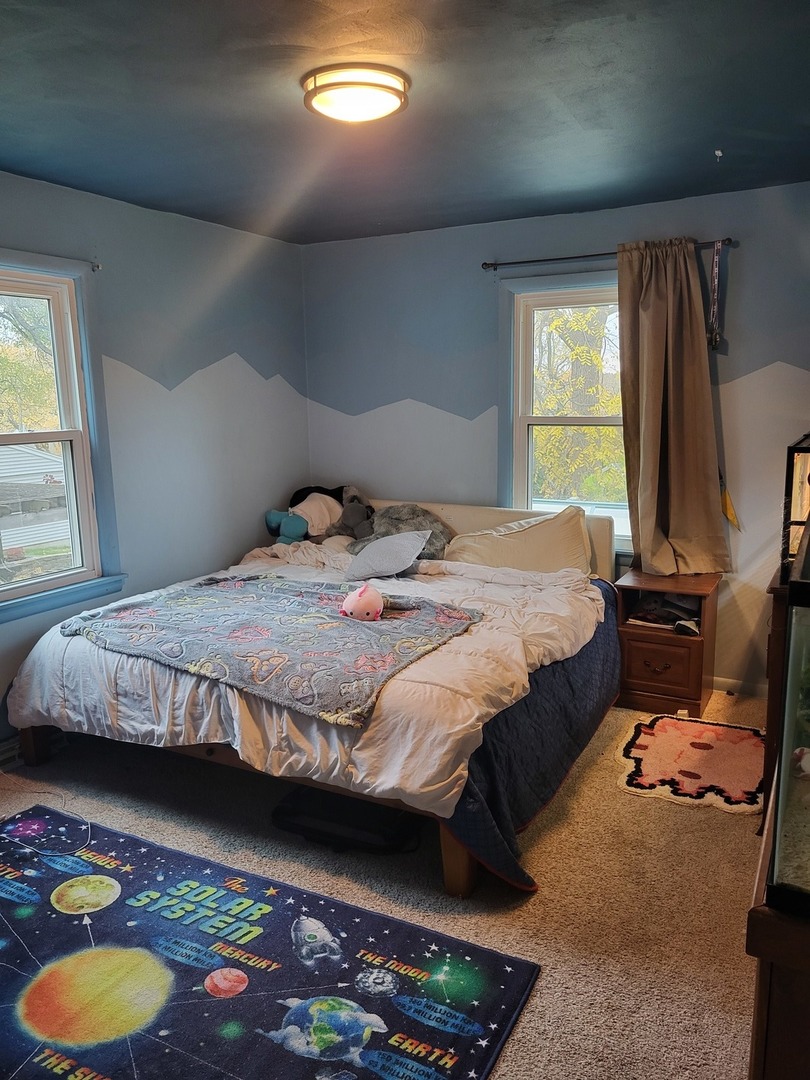 914 Cooper Street Dixon, IL 61021 - Photo 8 of 10 a bedroom with a bed and a window