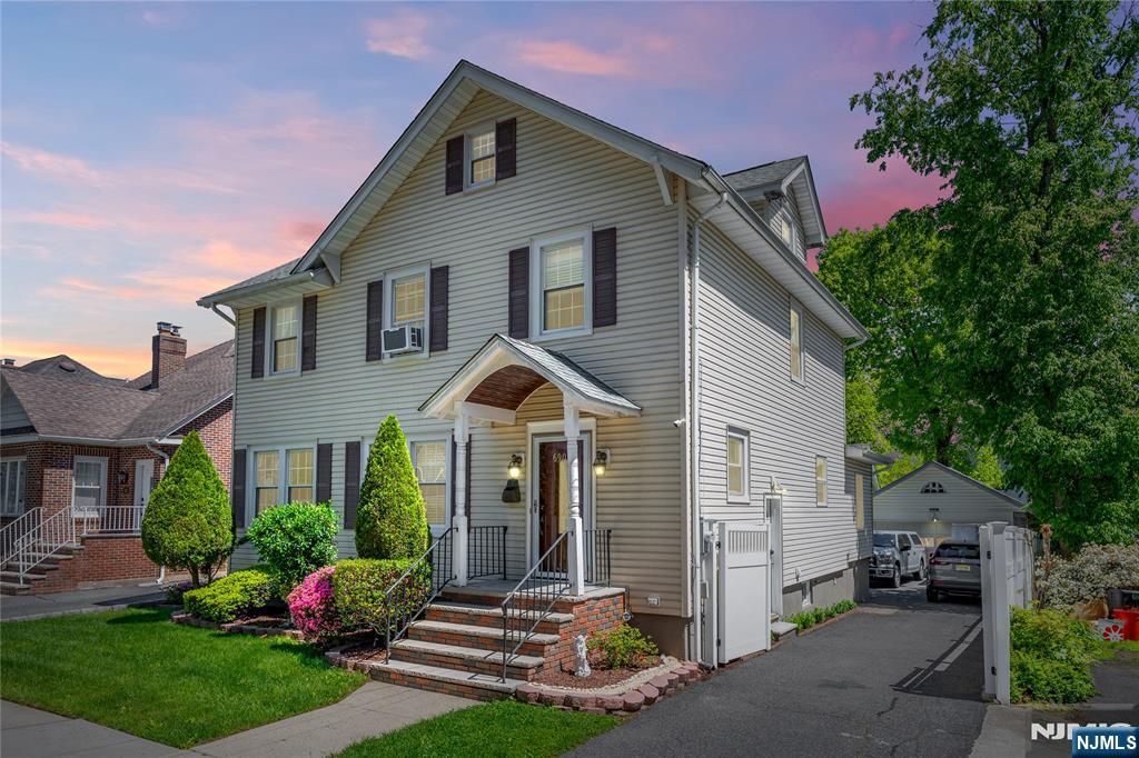 690 Garden Street Maywood, NJ 07607 - Photo 1 of 49 a front view of a house with a yard and porch