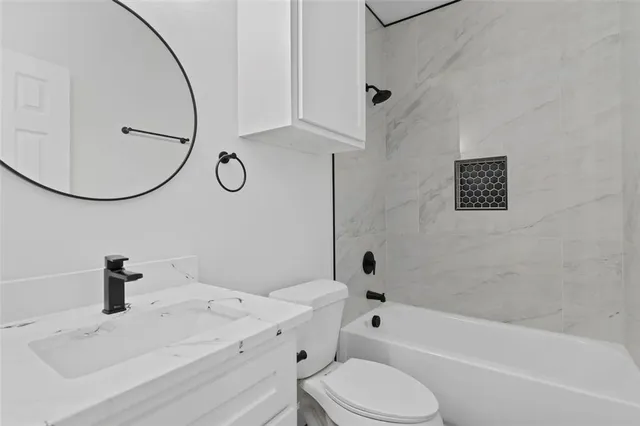 a bathroom with a sink toilet and bathtub