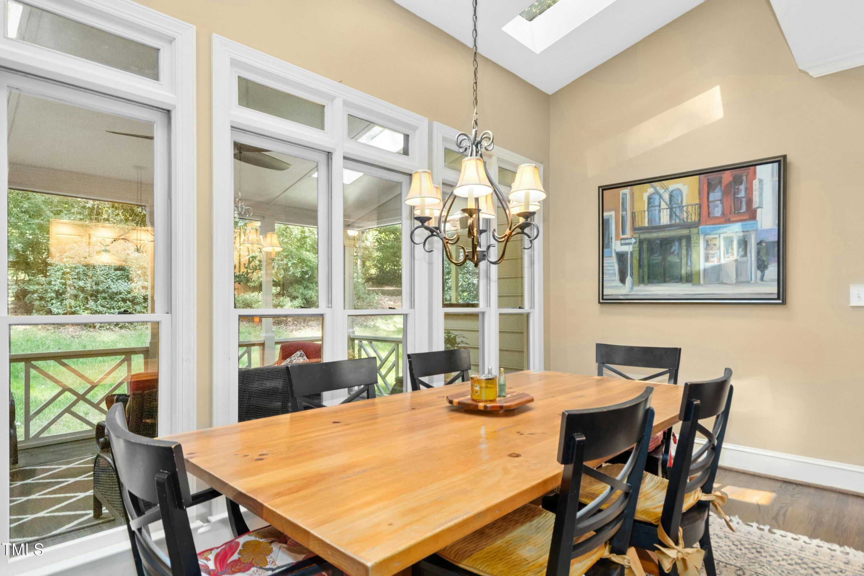12317 Lockhart Lane Raleigh, NC 27614 - Photo 15 of 38 a view of a dining room with furniture window and outside view