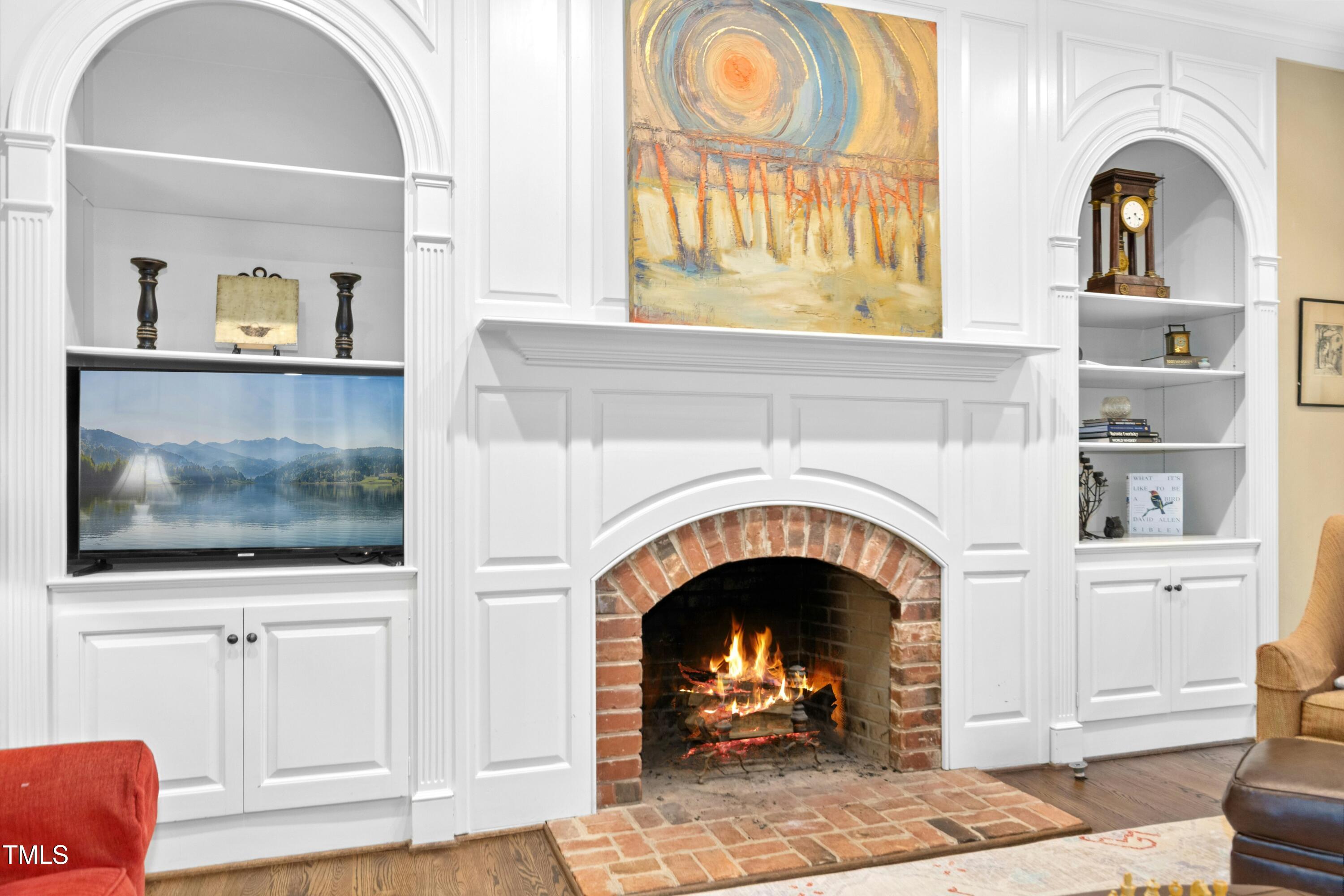 12317 Lockhart Lane Raleigh, NC 27614 - Photo 18 of 38 a living room with fireplace and a fireplace