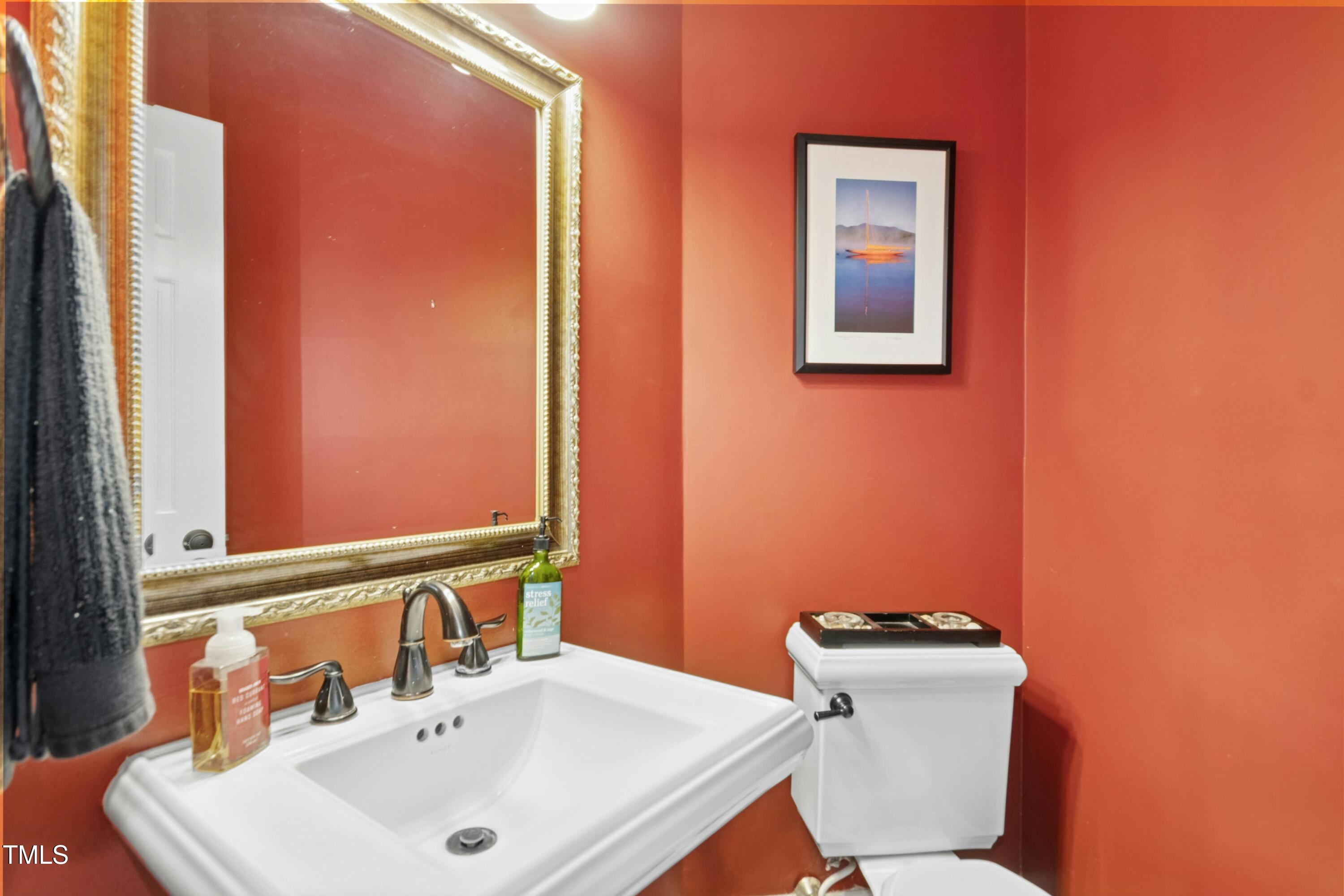 12317 Lockhart Lane Raleigh, NC 27614 - Photo 19 of 38 a bathroom with a sink and a toilet
