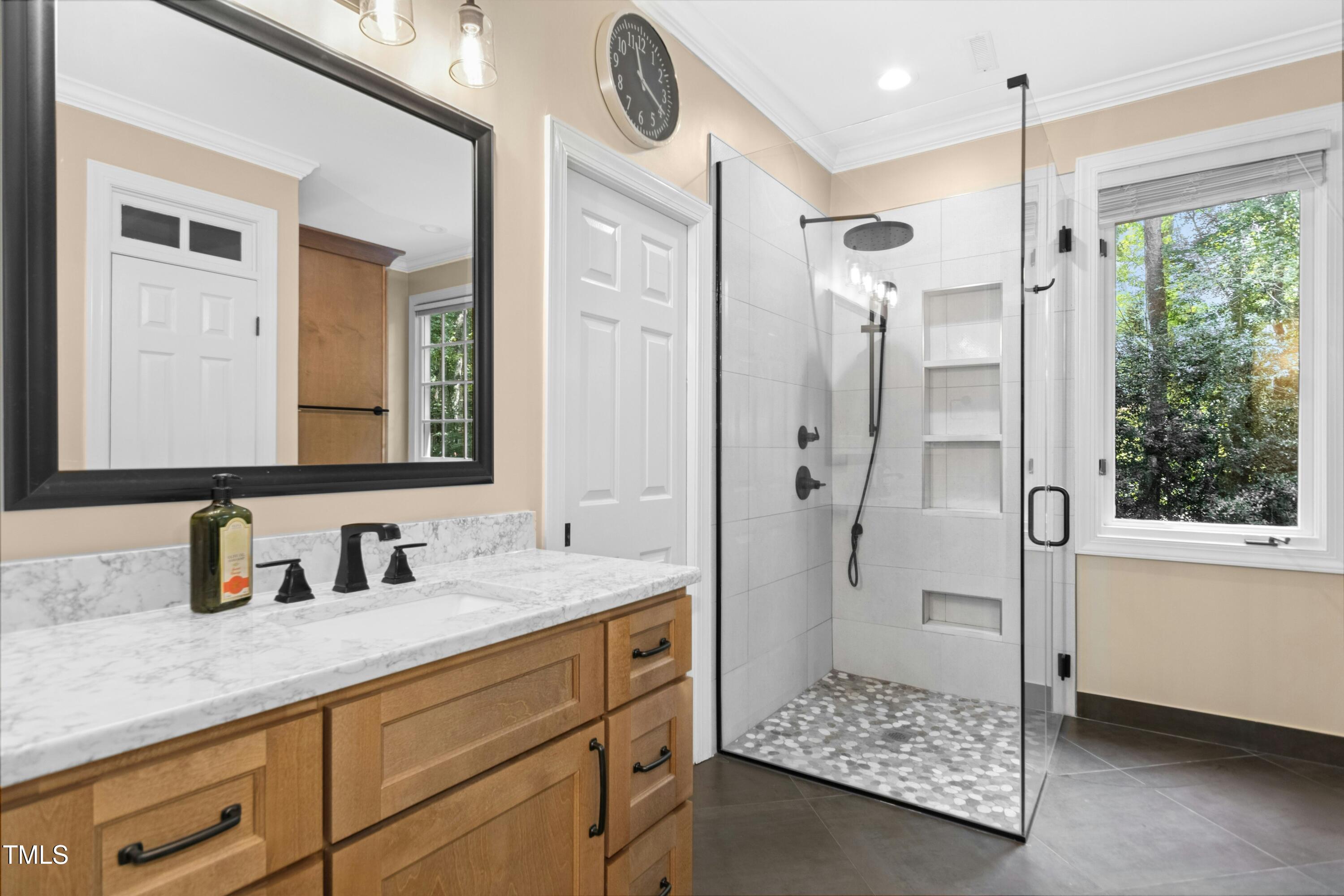 12317 Lockhart Lane Raleigh, NC 27614 - Photo 26 of 38 a bathroom with a double vanity sink mirror and shower