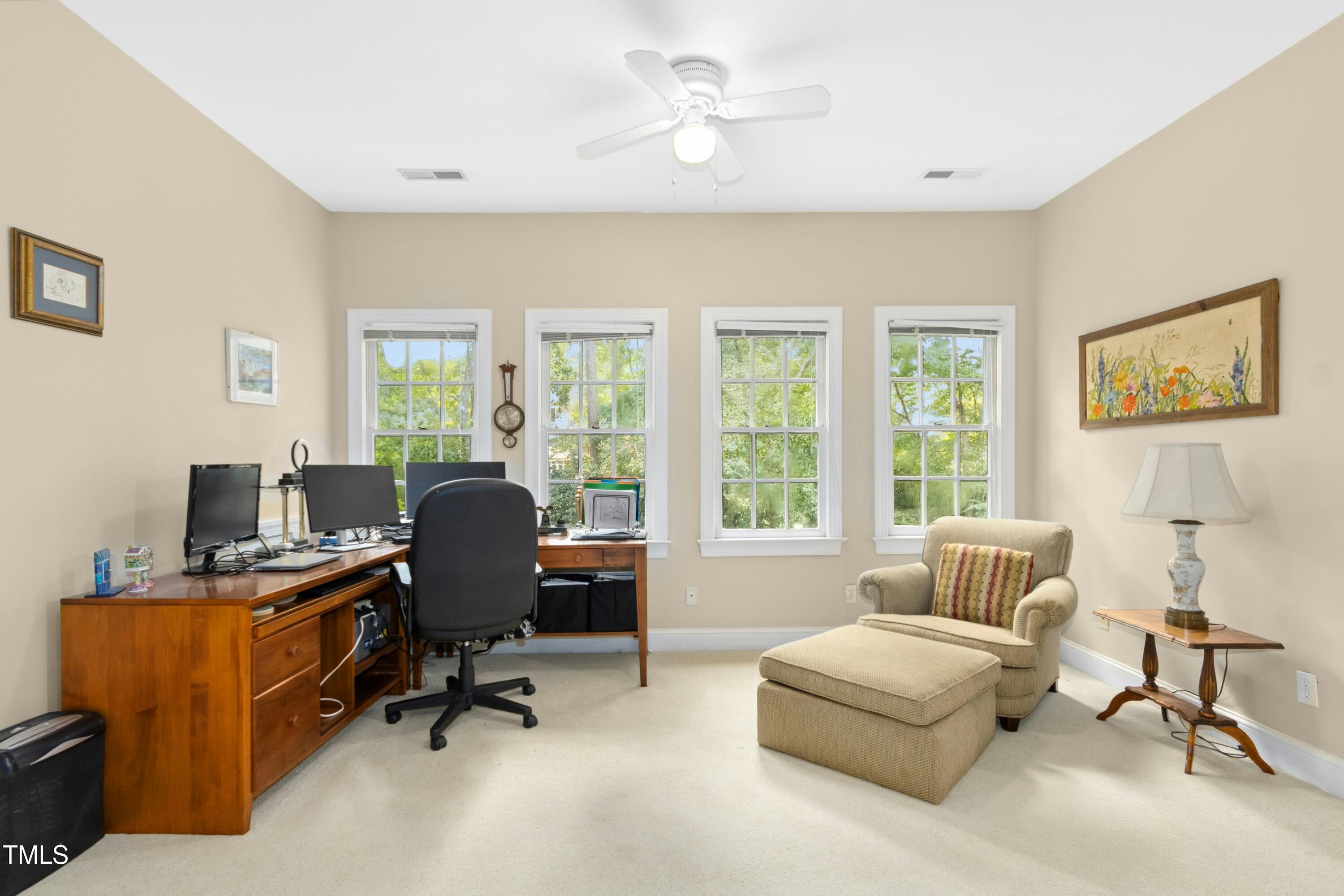 12317 Lockhart Lane Raleigh, NC 27614 - Photo 34 of 38 a view of a livingroom with workspace and a window