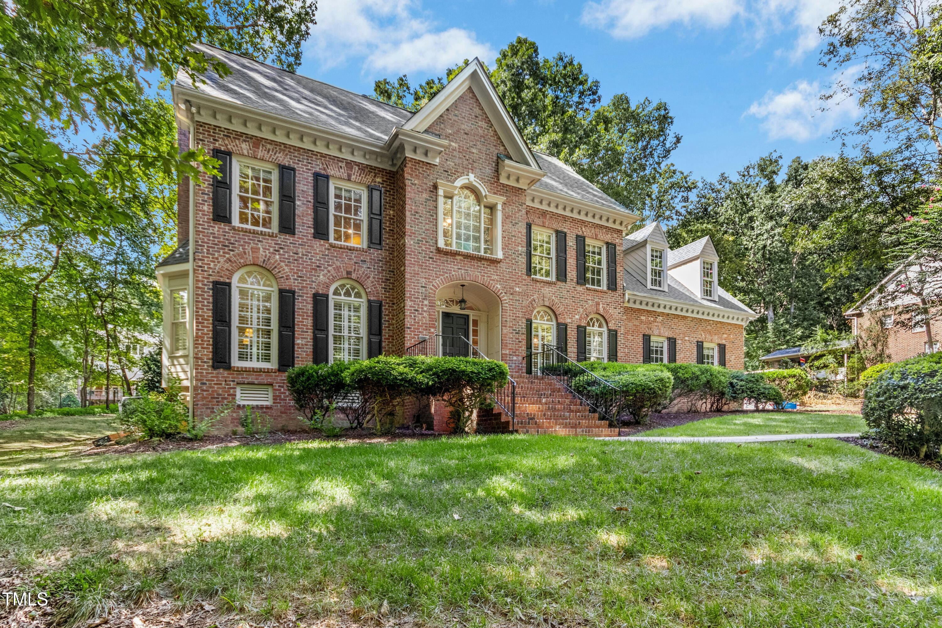 12317 Lockhart Lane Raleigh, NC 27614 - Photo 37 of 38 a front view of a house with a yard