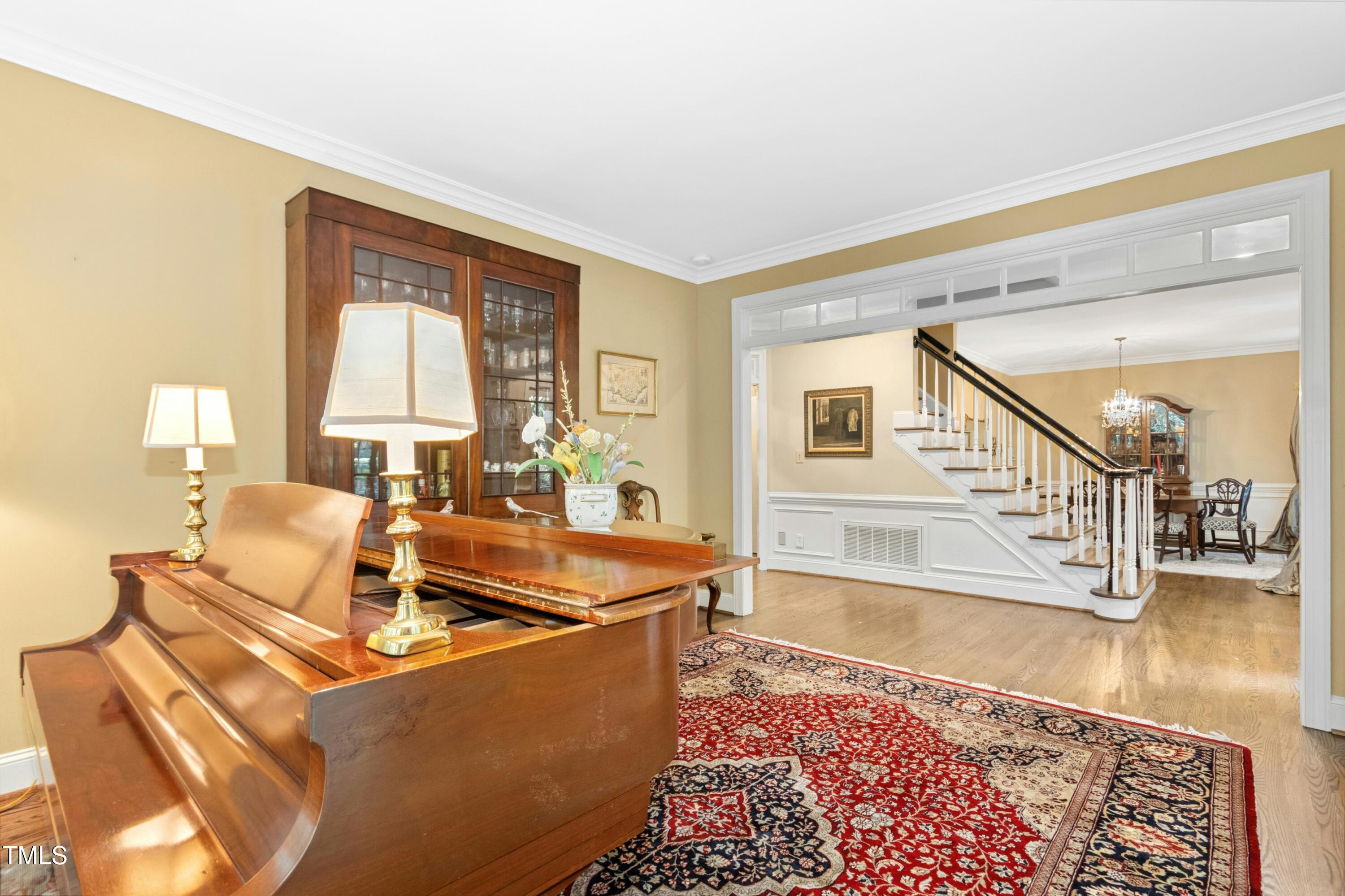 12317 Lockhart Lane Raleigh, NC 27614 - Photo 4 of 38 a living room with furniture and a rug