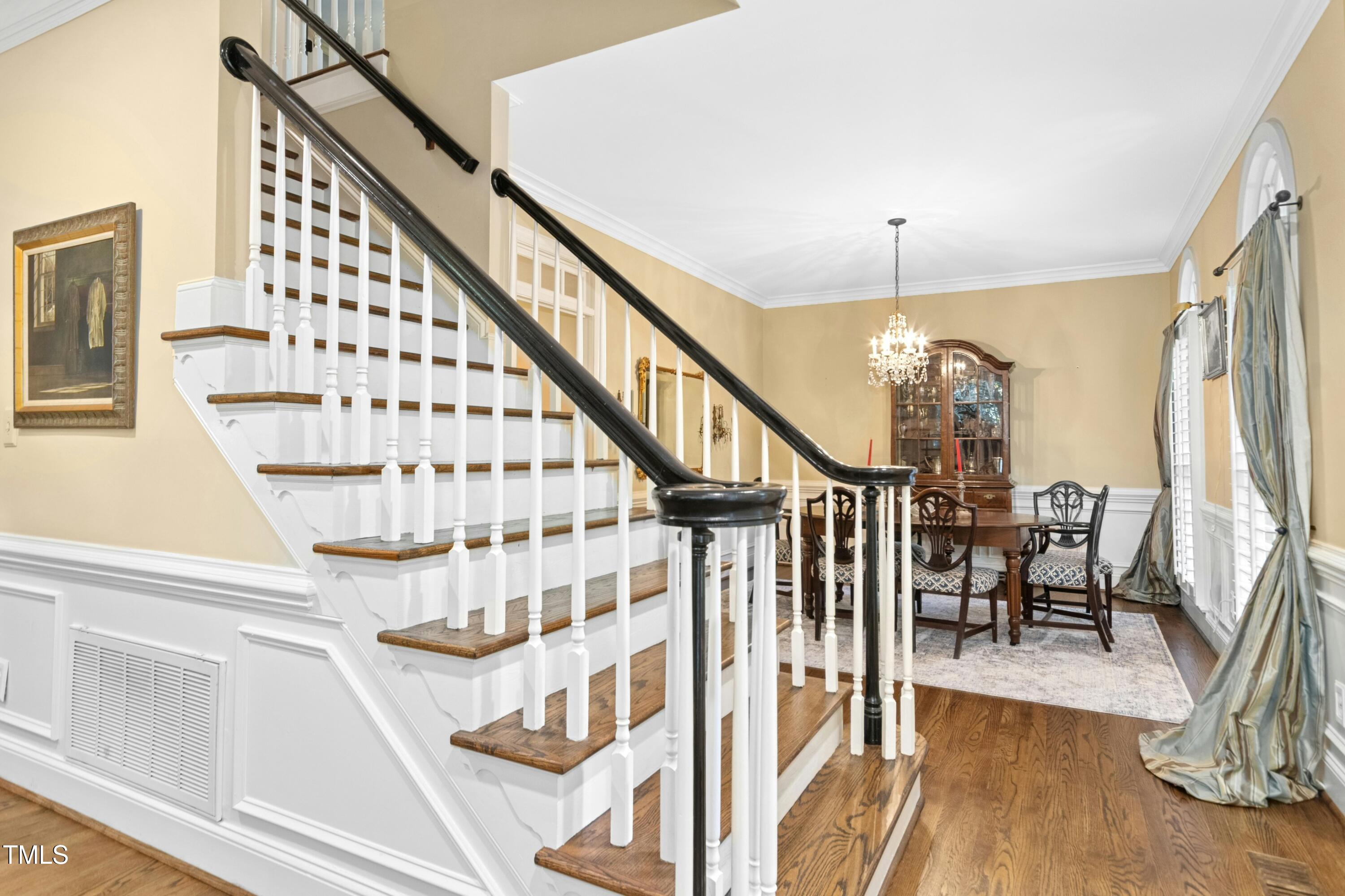 12317 Lockhart Lane Raleigh, NC 27614 - Photo 5 of 38 a view of entryway and hall with wooden floor