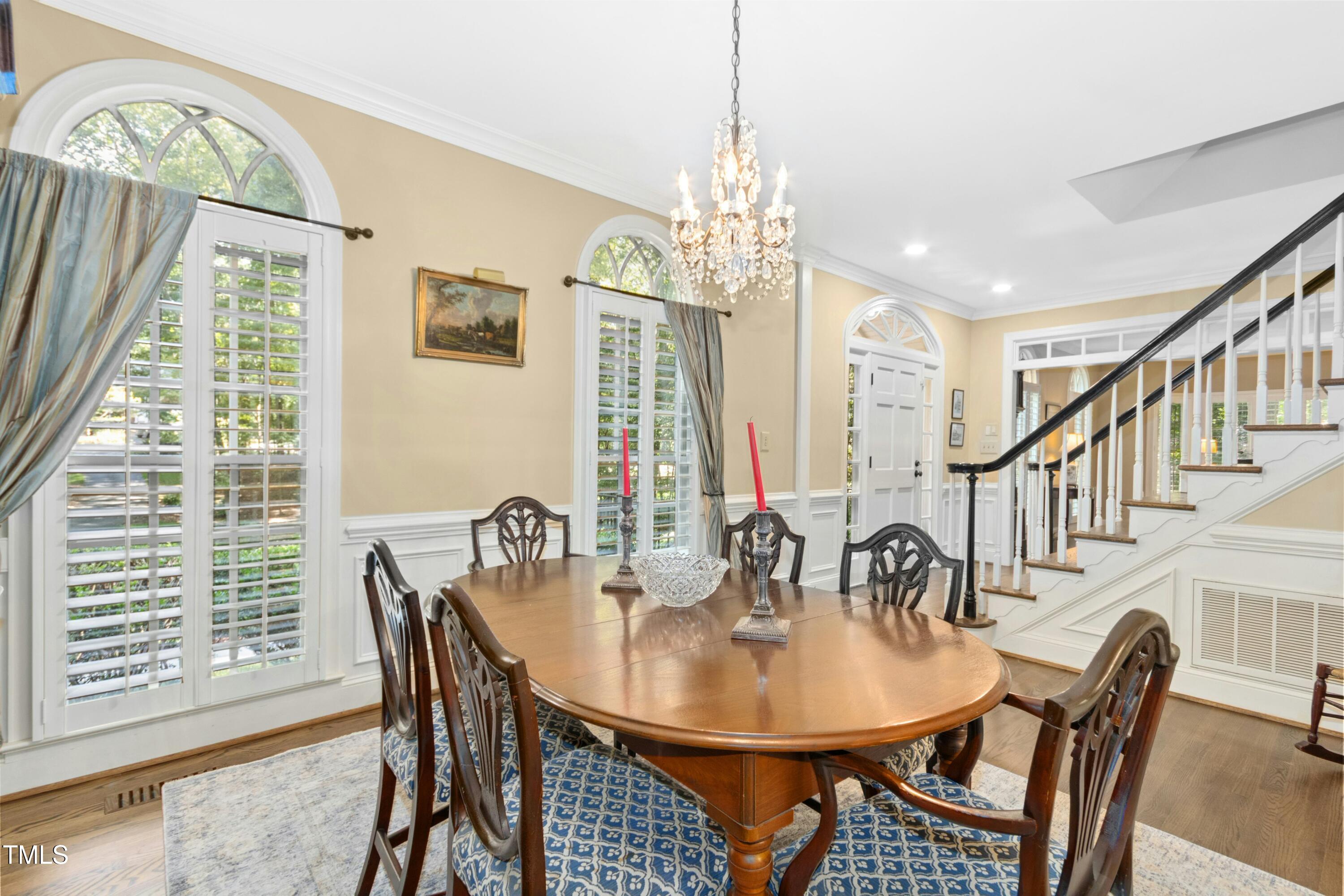 12317 Lockhart Lane Raleigh, NC 27614 - Photo 7 of 38 a view of a dining room with furniture window and wooden floor