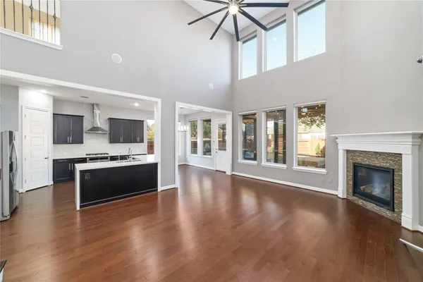 a large kitchen with a stove top oven and refrigerator