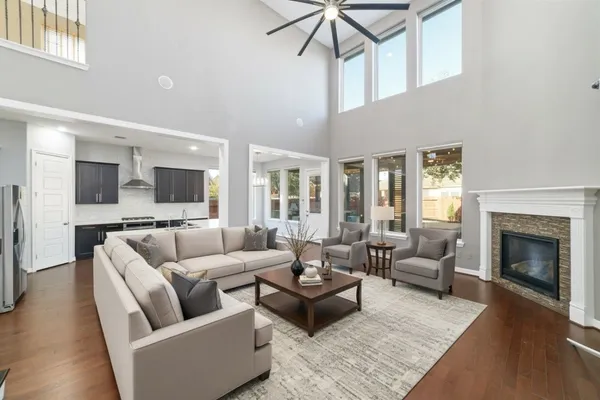 a living room with furniture and a fireplace