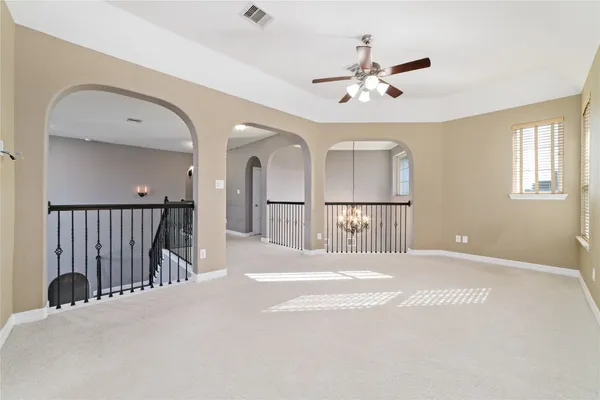 a view of a hallway with a chandelier