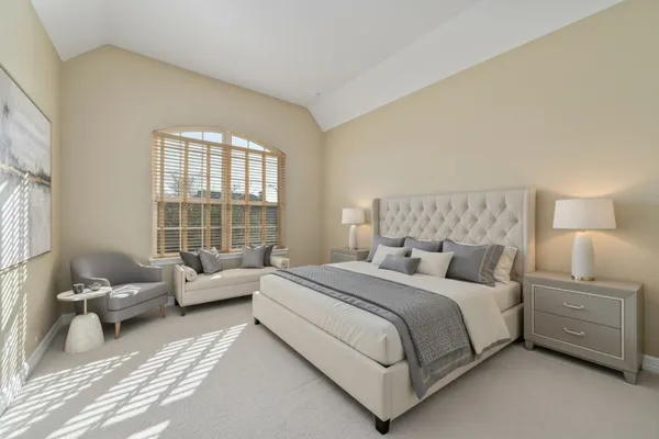 a bedroom with a bed and couch