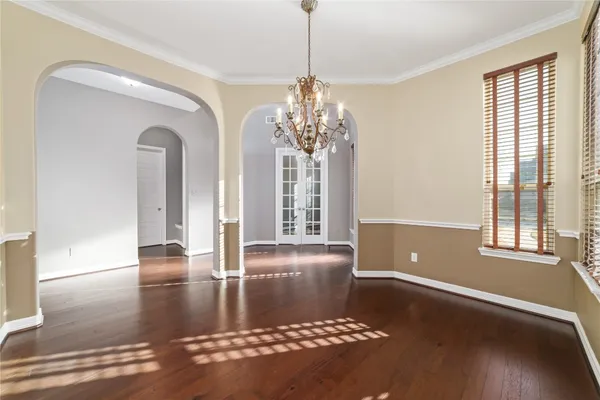 a view of a room with window and chandelier