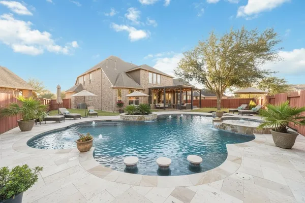 a view of a swimming pool and lounge chair