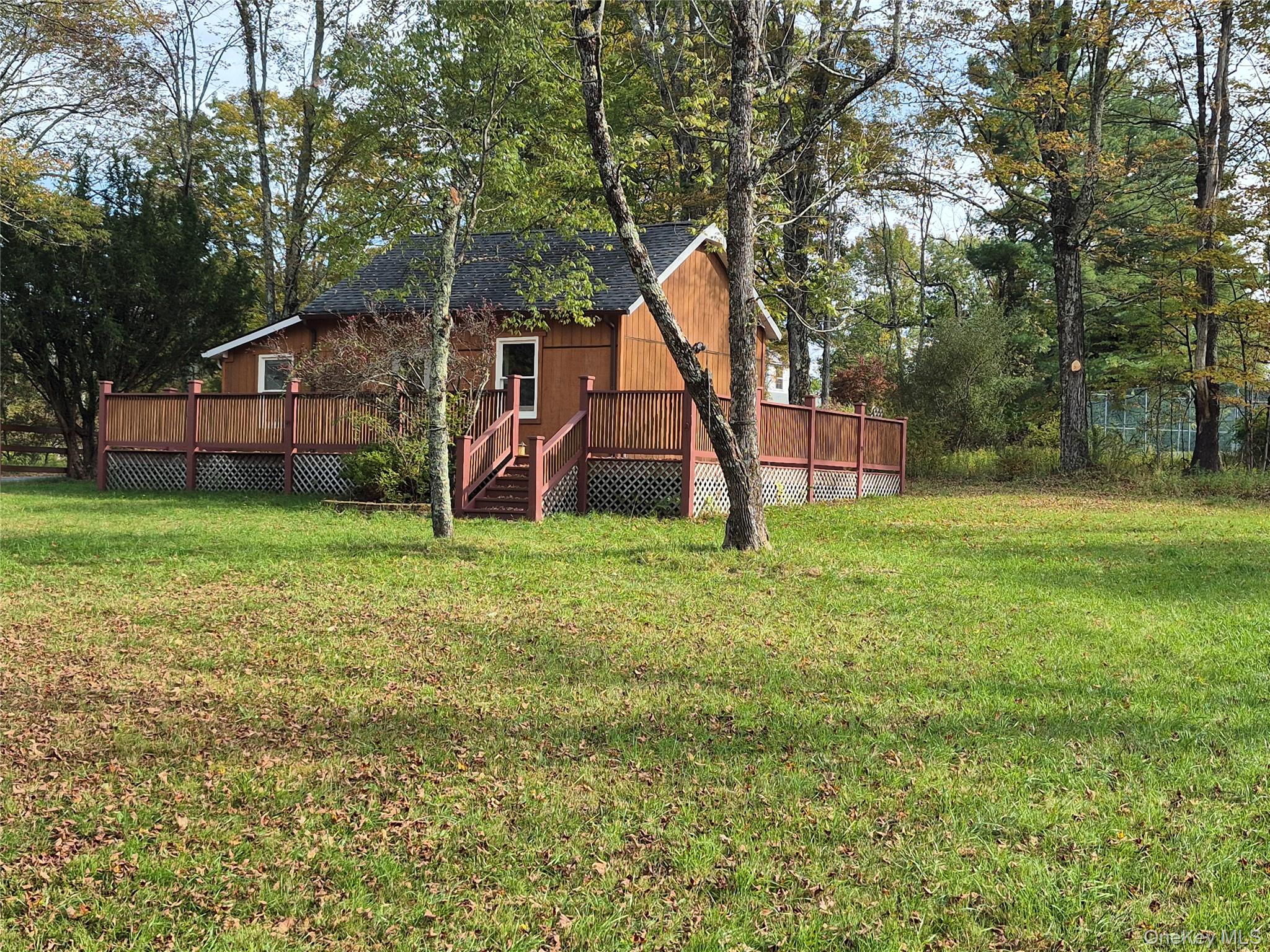 598 Oak Ridge Road Ellenville, NY 12428 - Photo 1 of 1 a view of a house with a yard and tree s