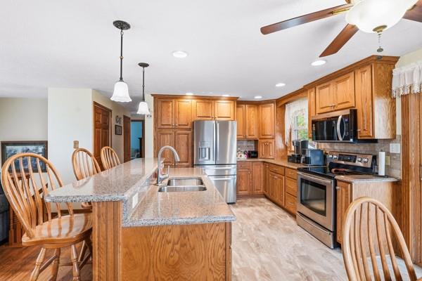 19 Yankee Ridge Road Mercer, PA 16137 - Photo 11 of 42 a kitchen with stainless steel appliances granite countertop a sink a stove and a refrigerator