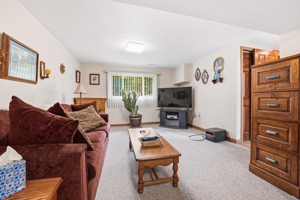 19 Yankee Ridge Road Mercer, PA 16137 - Photo 19 of 42 a living room with furniture a window and a flat screen tv