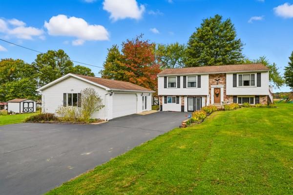 19 Yankee Ridge Road Mercer, PA 16137 - Photo 2 of 42 a view of a yard in front of a house with large trees