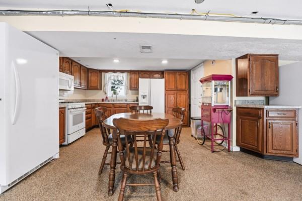 19 Yankee Ridge Road Mercer, PA 16137 - Photo 24 of 42 a kitchen with stainless steel appliances a stove a sink refrigerator and a microwave