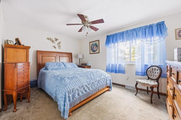 19 Yankee Ridge Road Mercer, PA 16137 - Photo 26 of 42 a bedroom with a bed and a chandelier