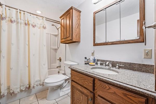 19 Yankee Ridge Road Mercer, PA 16137 - Photo 29 of 42 a bathroom with a granite countertop sink a toilet and a mirror