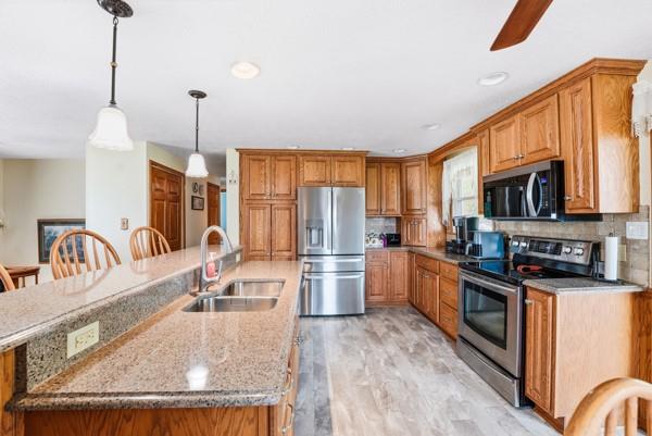 19 Yankee Ridge Road Mercer, PA 16137 - Photo 8 of 42 a kitchen with stainless steel appliances granite countertop a sink a stove and a wooden floors