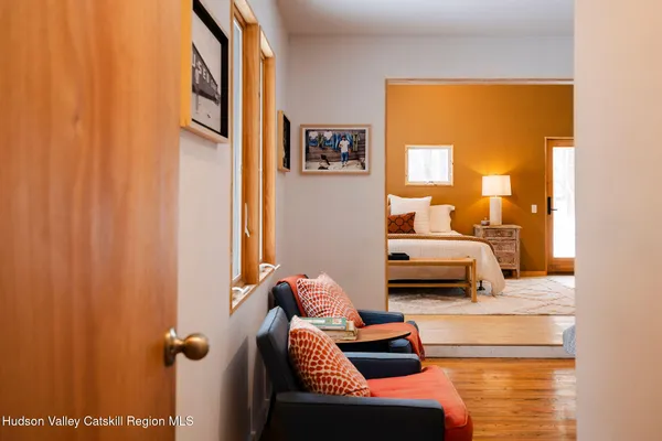 a bedroom with furniture and a window