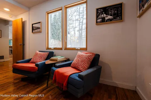 a living room with furniture and a window