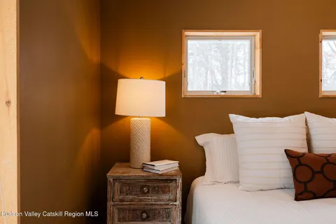 a bed room with a bed and a lamp