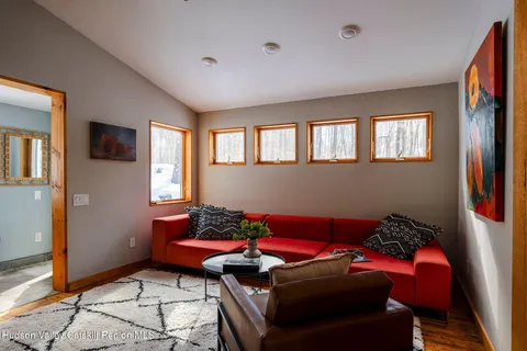 a living room with furniture and a window