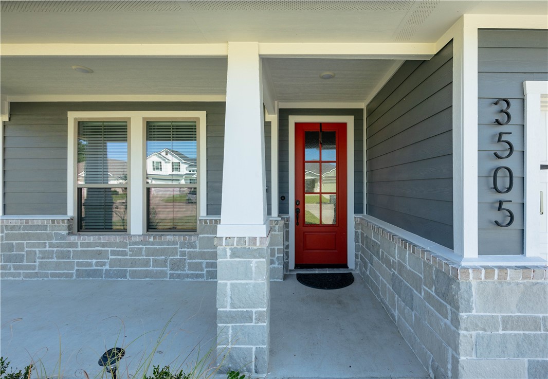 3505 Chantilly Path Bryan, TX 77808 - Photo 2 of 8 Inviting front porch featuring a vibrant red entry door