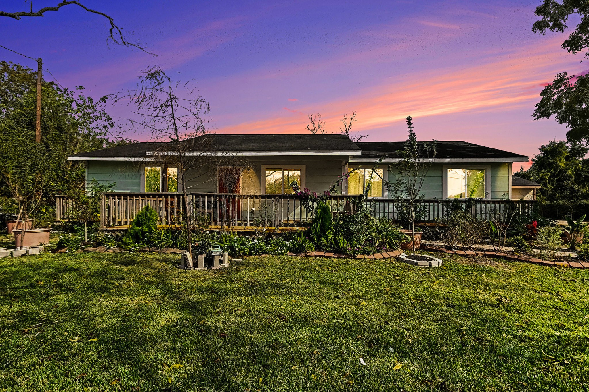 1627 Texas Avenue League City, TX 77573 - Photo 1 of 26 a front view of a house with yard and outdoor seating