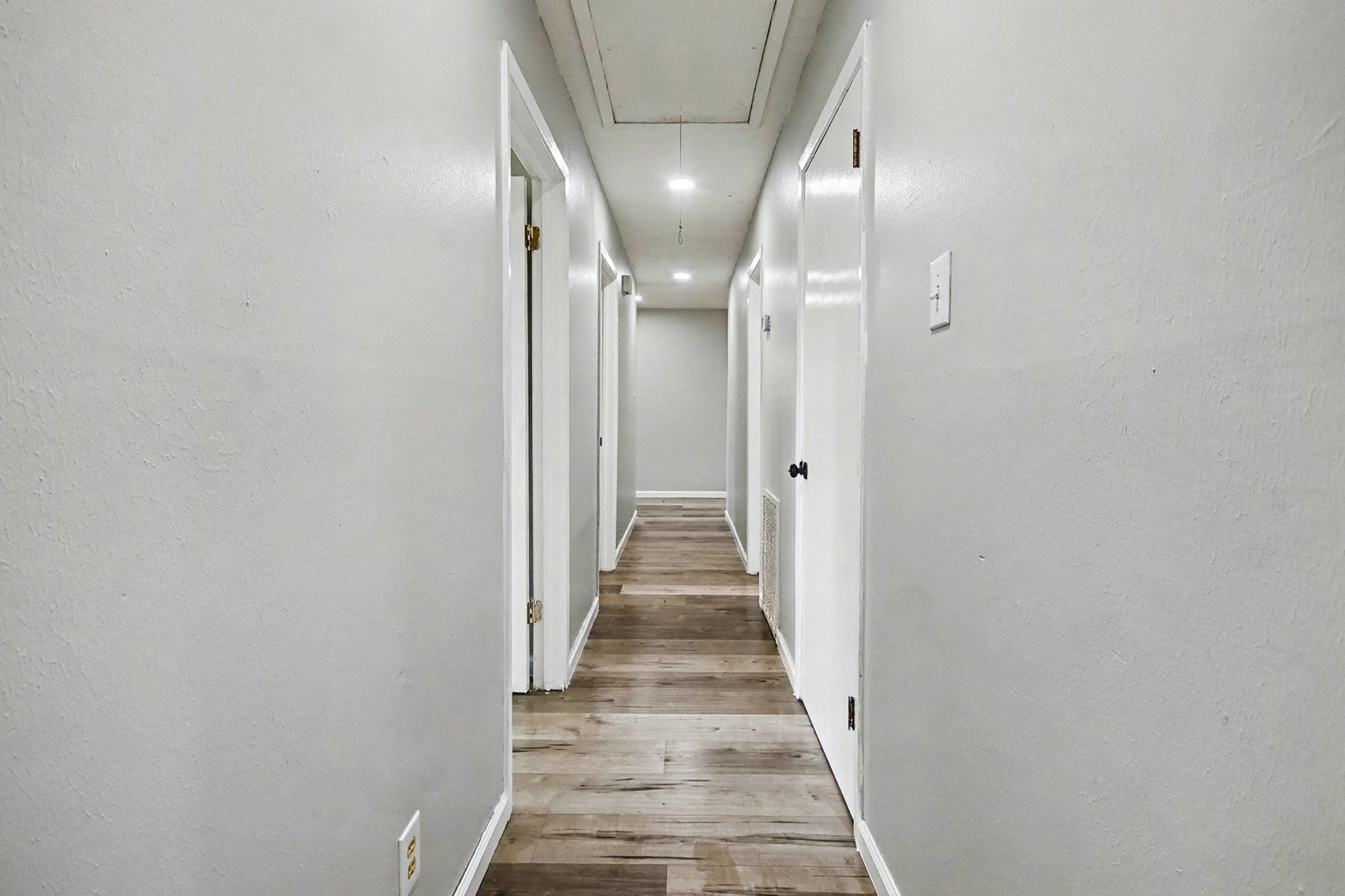 1627 Texas Avenue League City, TX 77573 - Photo 13 of 26 a view of a hallway with wooden floor