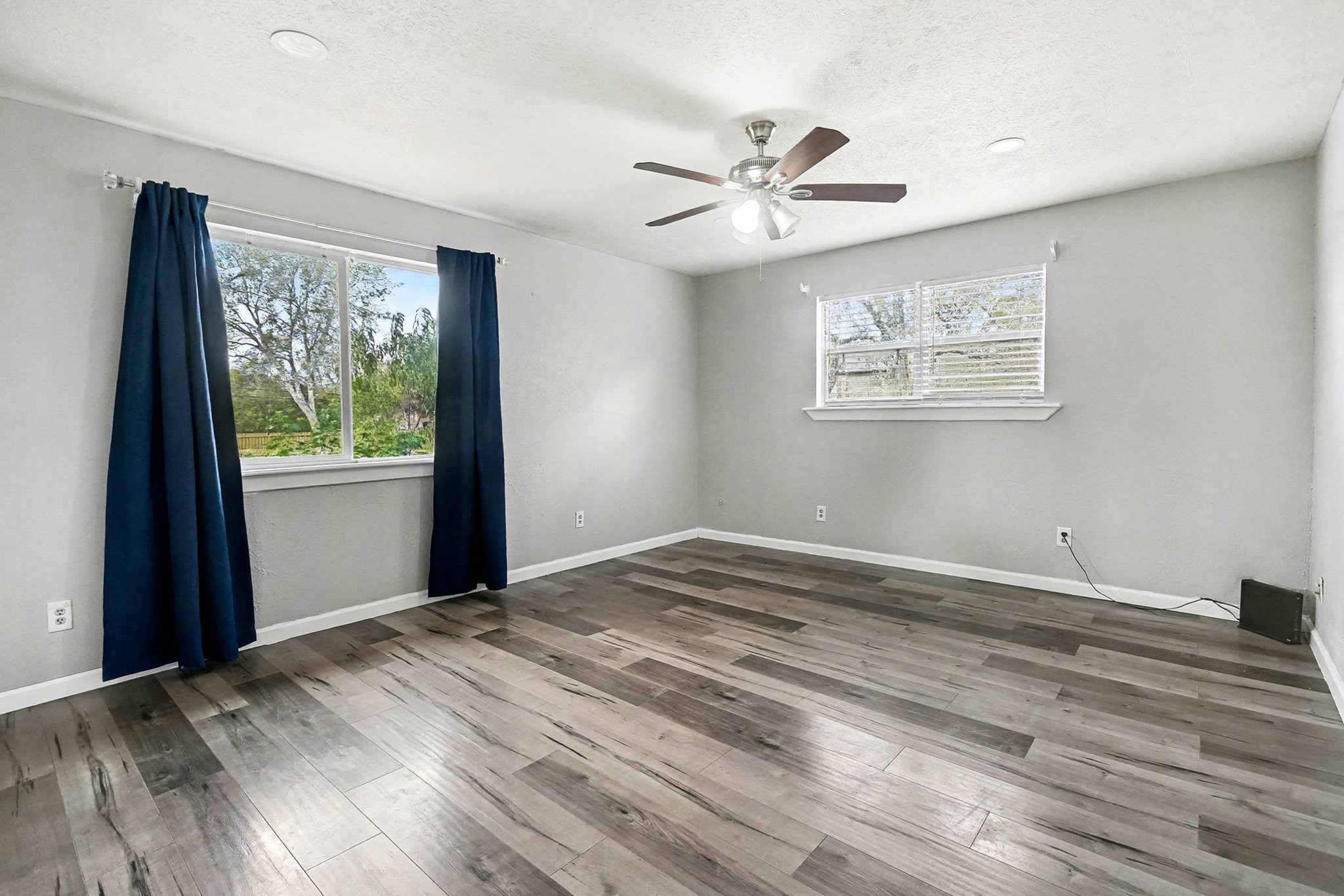 1627 Texas Avenue League City, TX 77573 - Photo 15 of 26 a view of a bedroom with wooden floor and windows