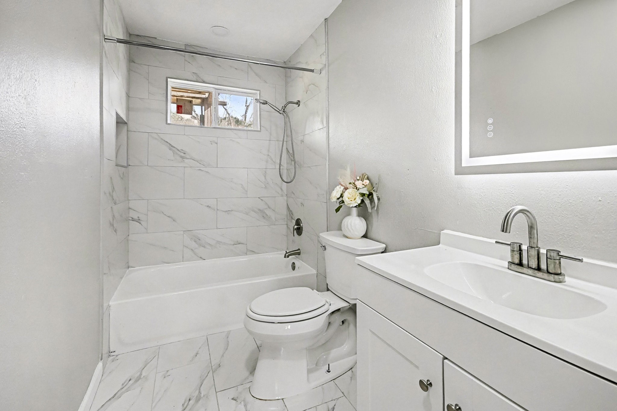 1627 Texas Avenue League City, TX 77573 - Photo 17 of 26 a bathroom with a sink toilet and shower