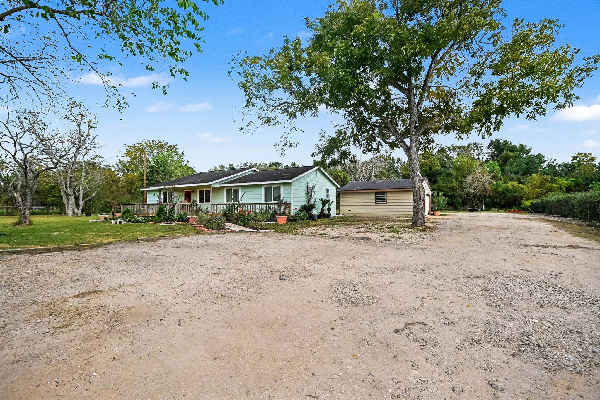 1627 Texas Avenue League City, TX 77573 - Photo 2 of 26 a front view of a house with a yard