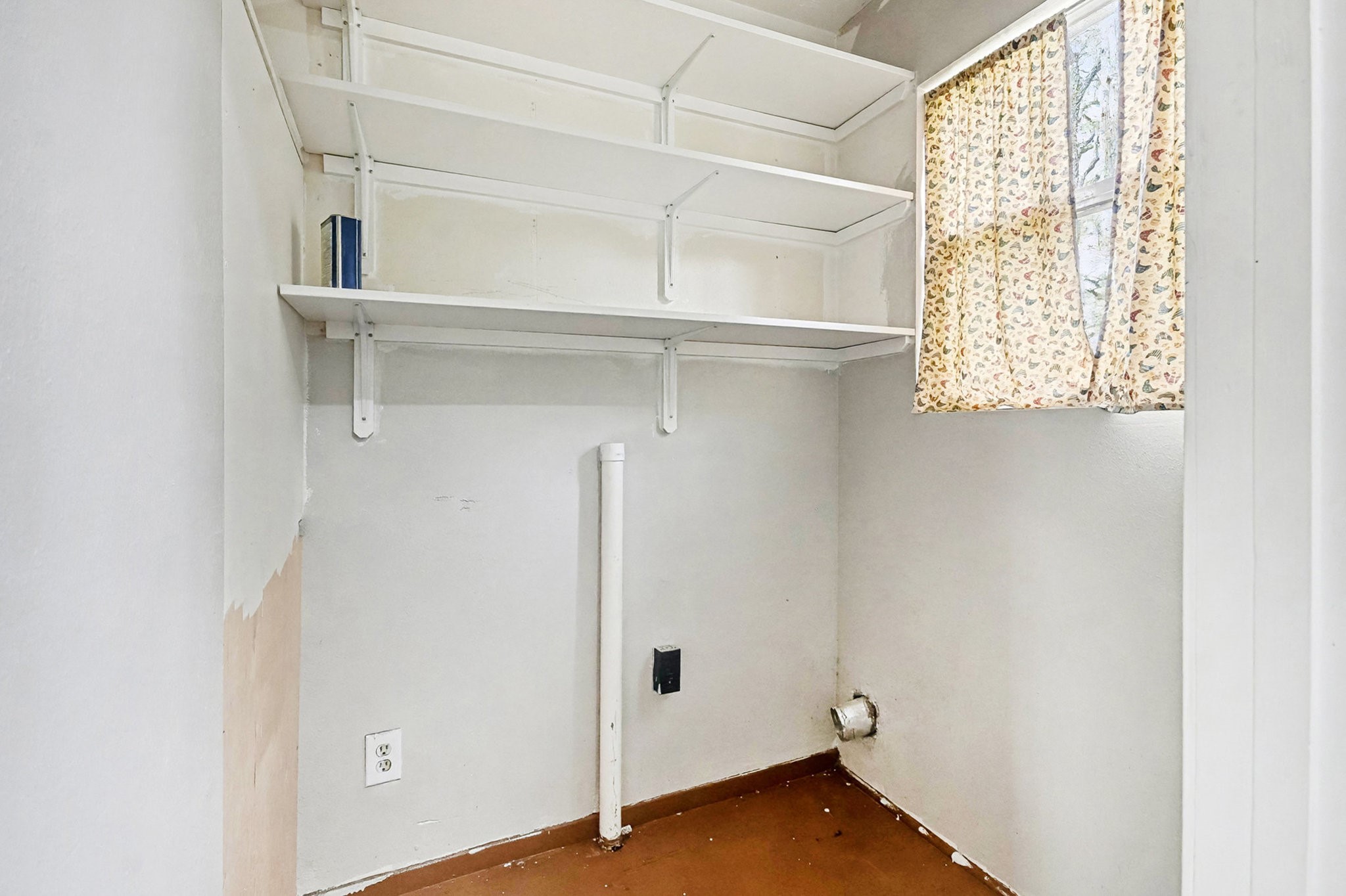 1627 Texas Avenue League City, TX 77573 - Photo 22 of 26 a view of a small space with racks on the wall