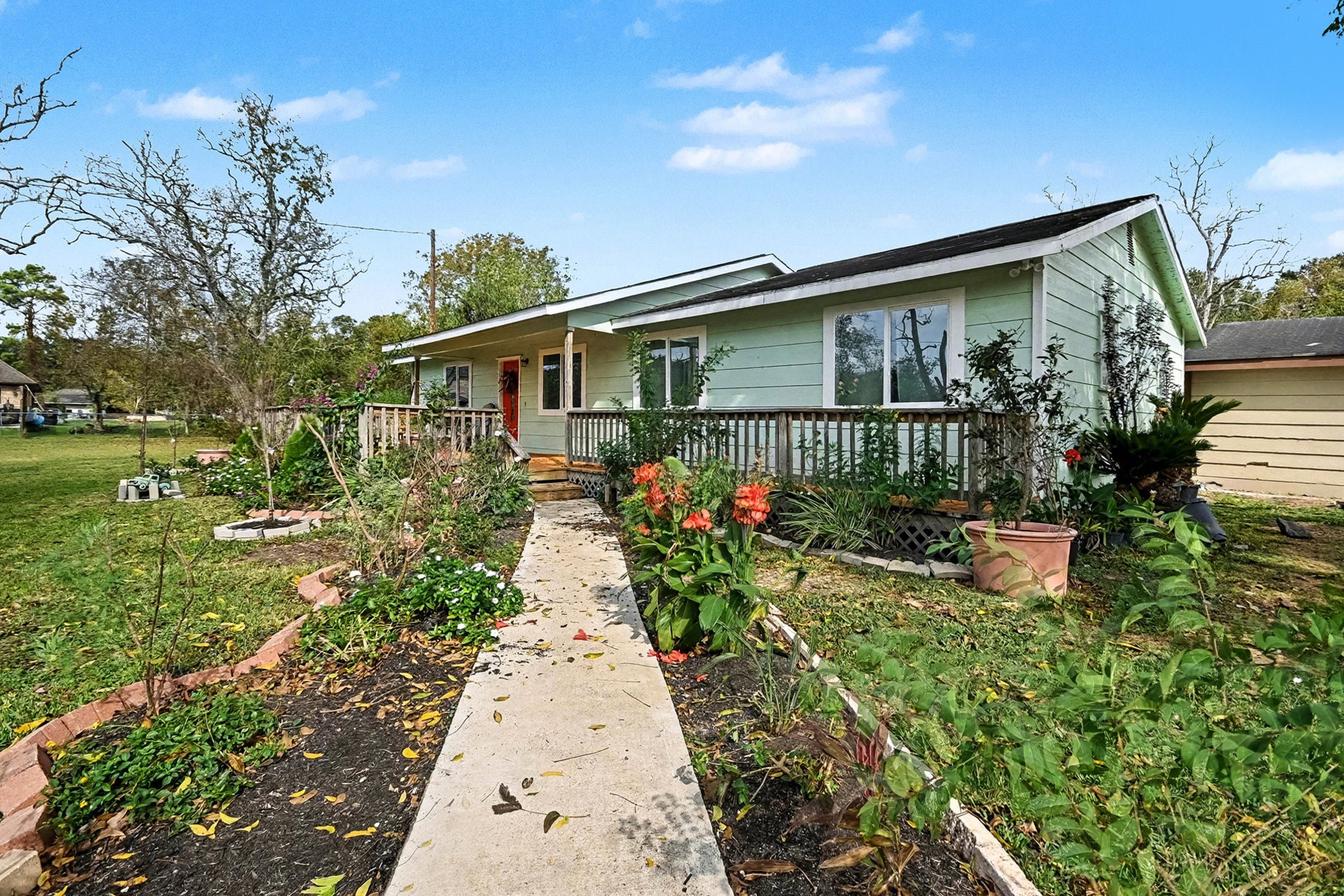 1627 Texas Avenue League City, TX 77573 - Photo 3 of 26 a front view of a house with a yard