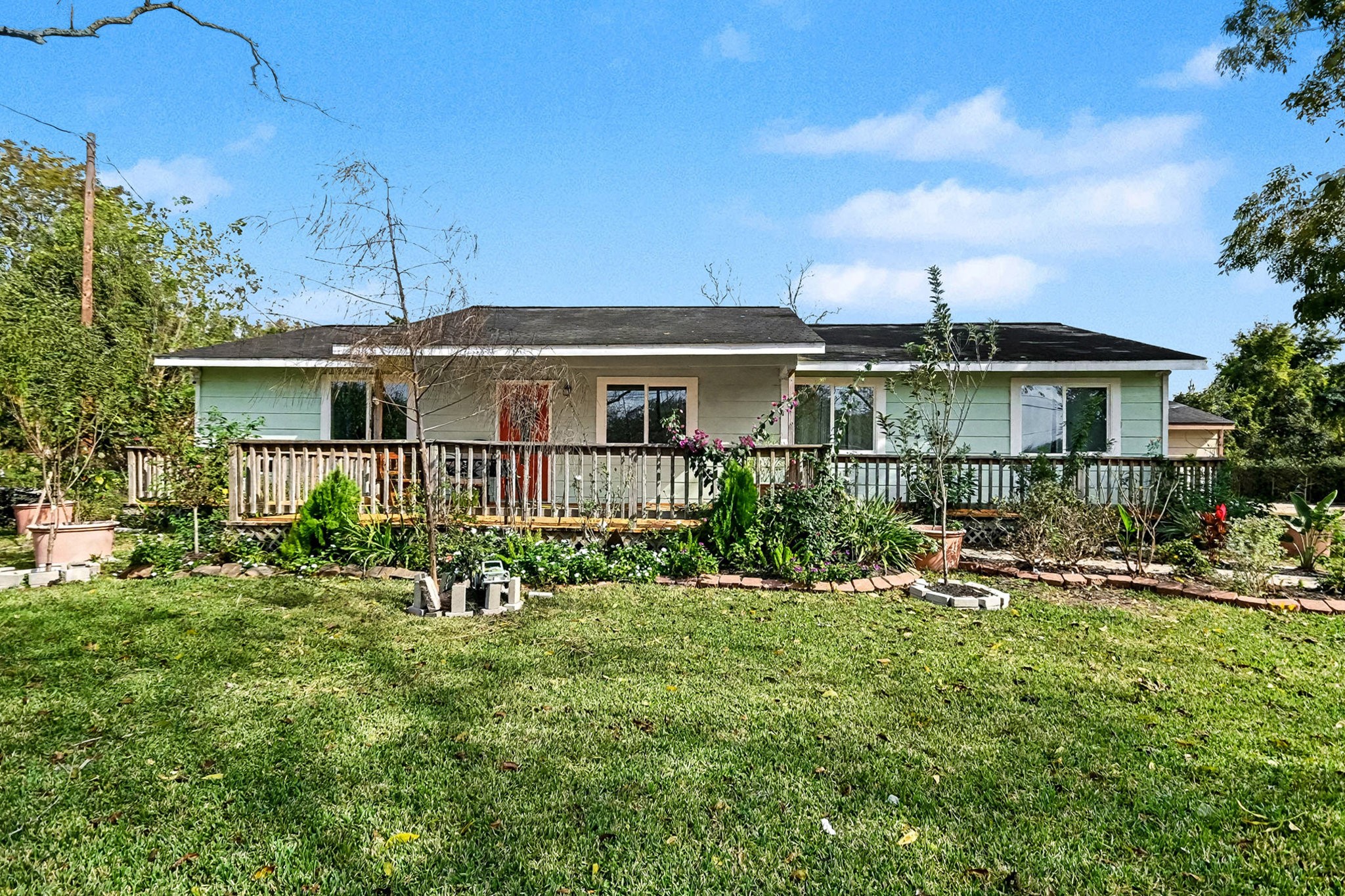 1627 Texas Avenue League City, TX 77573 - Photo 5 of 26 a front view of a house with yard and green space