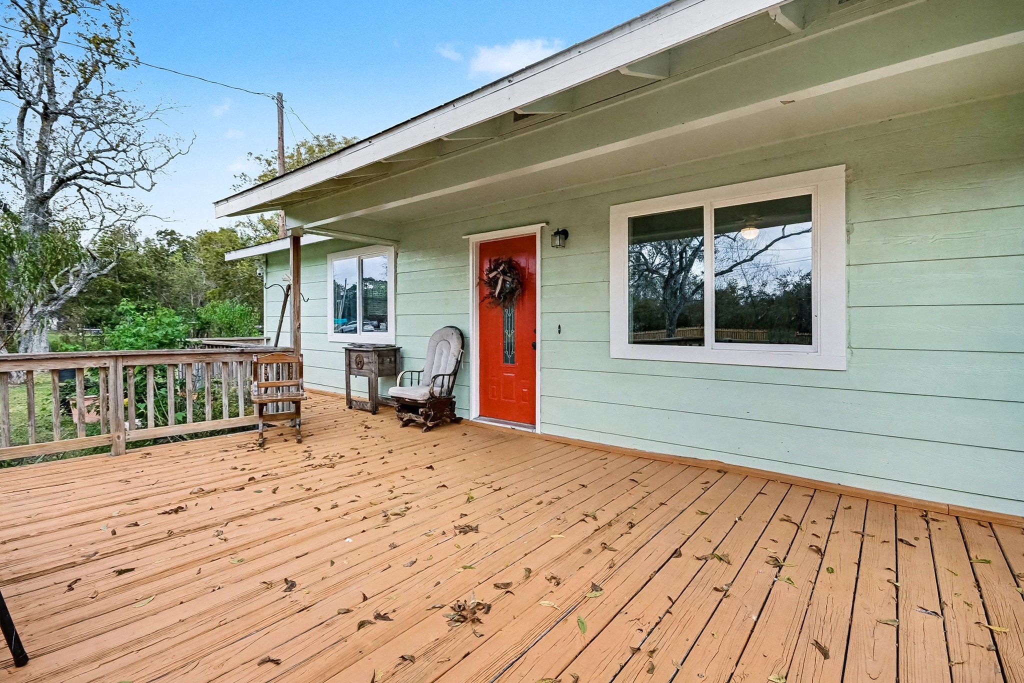1627 Texas Avenue League City, TX 77573 - Photo 7 of 26 a view of a house with wooden floor and wooden fence