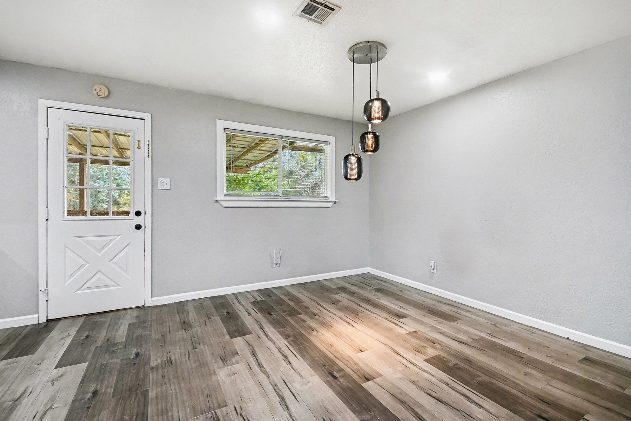 1627 Texas Avenue League City, TX 77573 - Photo 9 of 26 a view of empty room with wooden floor